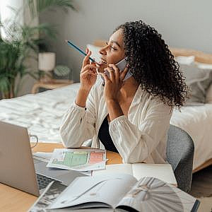 a client at a laptop during a virtual organising session