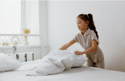 Sept-2024-blog-back to basics bedroom-child making bed.png