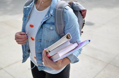 Sept 2023 Blog - University - student with books.jpg